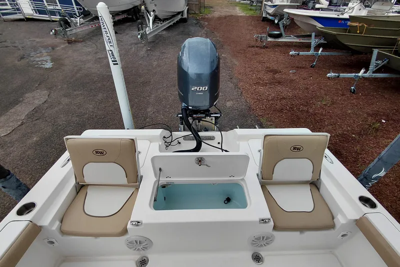 Slide: The Image of 2018 Key West 230 Bay Reef boat with Yamaha 200 engine, featuring seating and storage. - 40