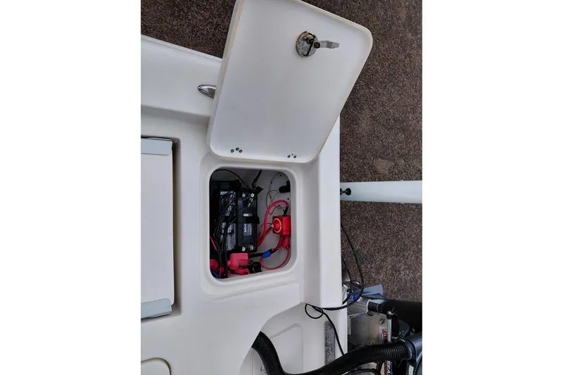 Slide: The Image of Open hatch of 2018 Key West 230 Bay Reef showing battery compartment. - 41