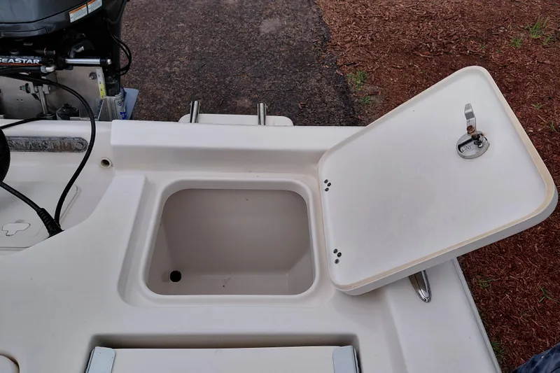 Slide: The Image of Open storage compartment on a 2018 Key West 230 Bay Reef boat. - 42