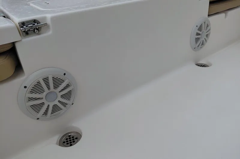 Slide: The Image of 2018 Key West 230 Bay Reef boat interior with speakers and drainage system. - 45