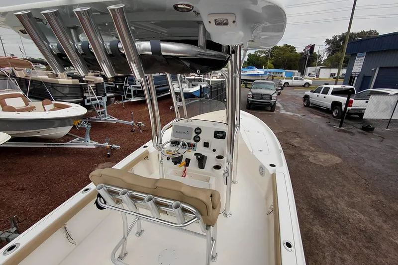 Slide: The Image of 2018 Key West 230 Bay Reef boat with center console and rod holders in a dealership lot. - 46