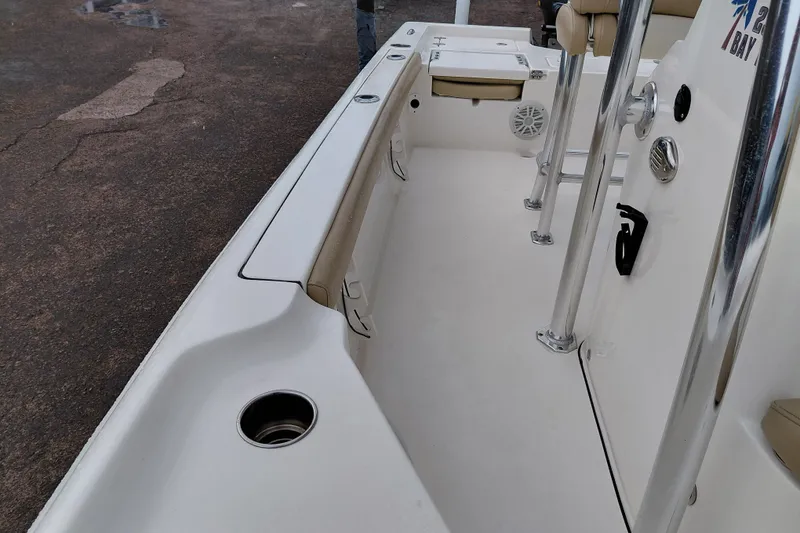 Slide: The Image of 2018 Key West 230 Bay Reef boat interior with seating and stainless steel fixtures. - 50