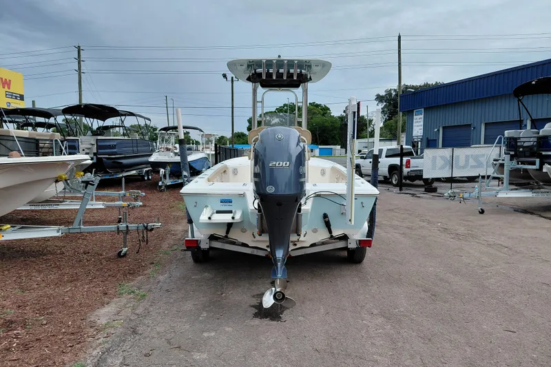 Slide: The Image of 2018 Key West 230 Bay Reef boat with Yamaha 200 engine, parked in a dealership lot. - 6