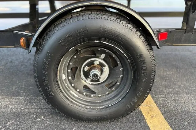 Slide: The Image of Trailer wheel of 2010 Sun Tracker Party Barge 21 Signature Series. - 22
