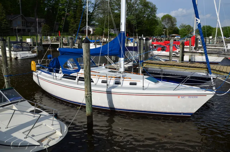 The Image of 1988 Catalina 34 sailboat docked in marina. - 0