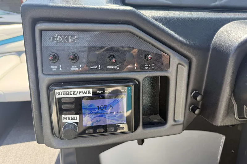 Slide: The Image of 2016 Axis A22 boat dashboard with control panel and media center display. - 13