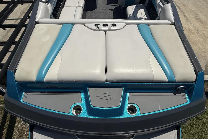 Slide: The Image of 2016 Axis A22 boat with blue and white seating, rear view. - 28
