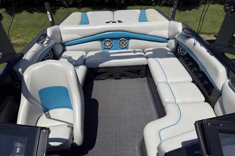 Slide: The Image of Interior of a 2016 Axis A22 boat with white and blue seating. - 9