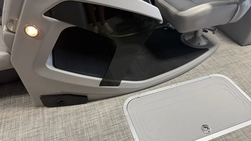Slide: The Image of Interior of a 2027 Barletta CABRIO24QC with gray flooring and seating area. - 41