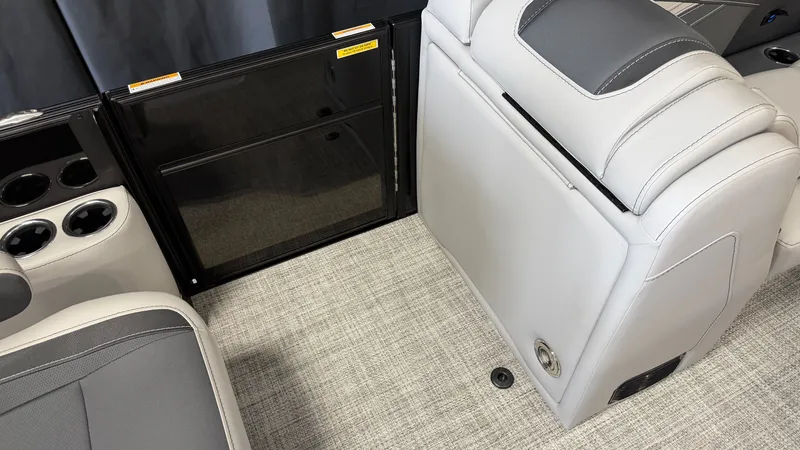 Slide: The Image of Interior of a 2027 Barletta CABRIO24QC with gray upholstery and cup holders. - 34