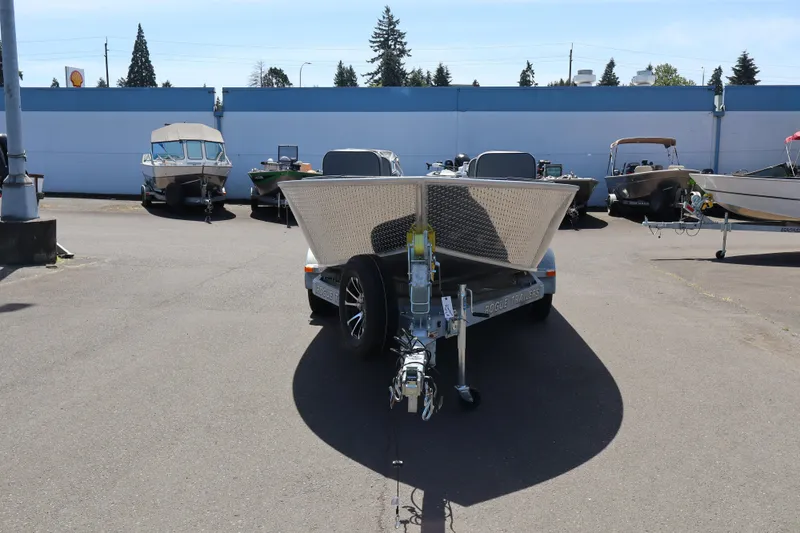 Slide: The Image of 2026 Alumaweld Super Vee Pro 21 boat on trailer in parking lot. - 2