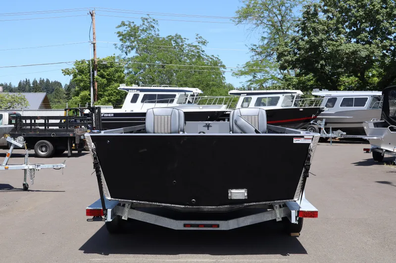 Slide: The Image of 2026 Alumaweld Super Vee Pro 21 boat on trailer, parked outdoors. - 4
