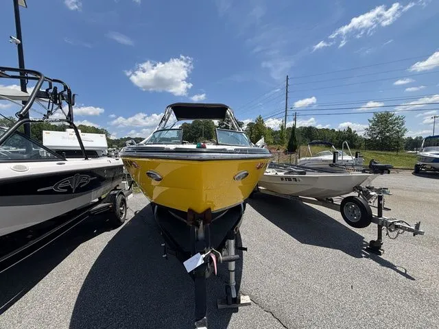 Slide: The Image of Yellow 2012 Monterey 224 FS boat parked on trailer. - 10