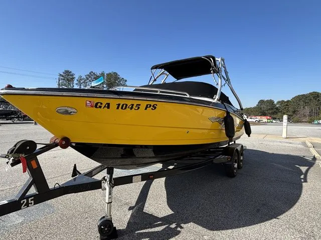 Slide: The Image of Yellow 2012 Monterey 224 FS boat on trailer. - 11