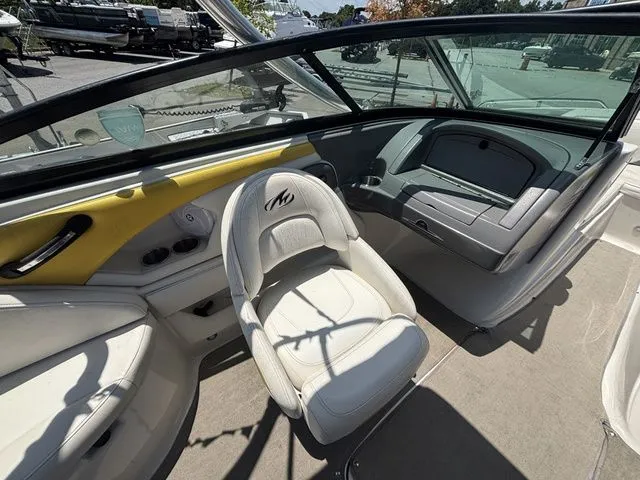 Slide: The Image of Interior of a 2012 Monterey 224 FS BR boat with leather seating. - 24