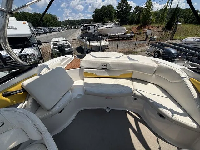Slide: The Image of Interior view of a 2012 Monterey 224 FS BR boat with seating area. - 26