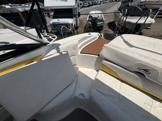 Slide: The Image of Interior of a 2012 Monterey 224 FS BR boat with seating area. - 28