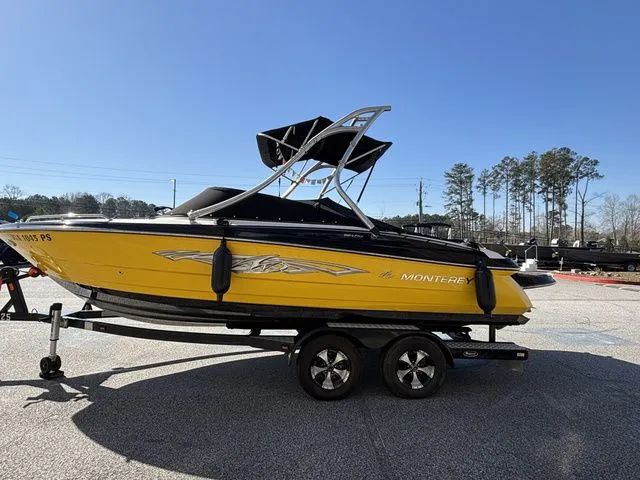 Slide: The Image of Yellow 2012 Monterey 224 FS boat on trailer. - 3