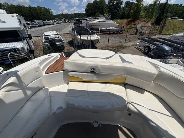 Slide: The Image of Interior view of a 2012 Monterey 224 FS BR boat on a parking lot. - 30