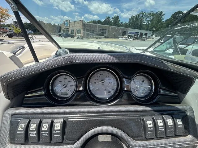 Slide: The Image of Dashboard of a 2012 Monterey 224 FS BR boat with gauges. - 31