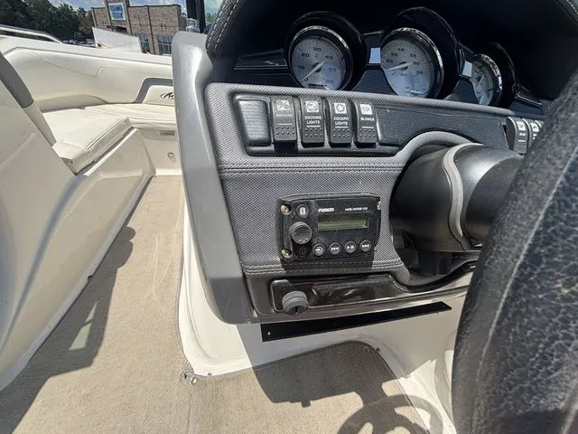 Slide: The Image of Dashboard of a 2012 Monterey 224 FS BR boat with controls and gauges. - 34