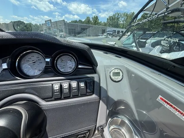 Slide: The Image of Dashboard of a 2012 Monterey 224 FS BR boat with instruments. - 36