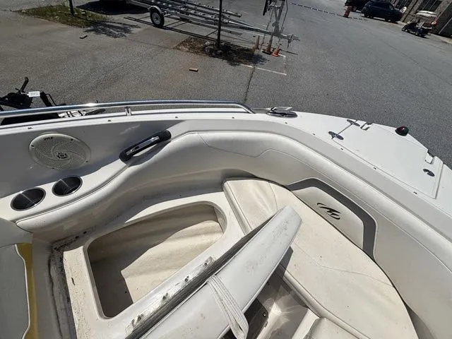Slide: The Image of Interior of a 2012 Monterey 224 FS BR boat, white upholstery. - 42