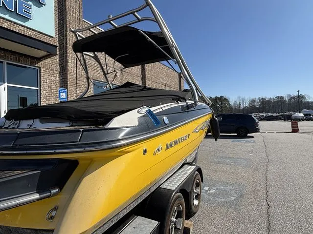 Slide: The Image of Yellow 2012 Monterey 224 FS boat on trailer. - 5