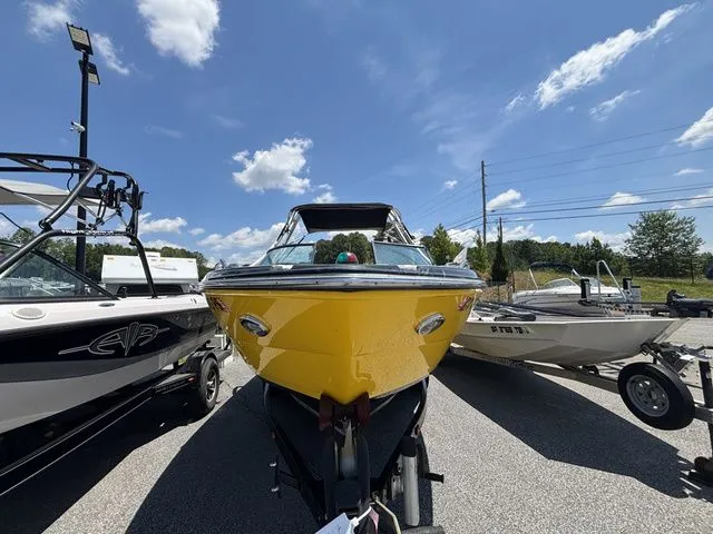 Slide: The Image of Yellow 2012 Monterey 224 FS boat on a trailer. - 7