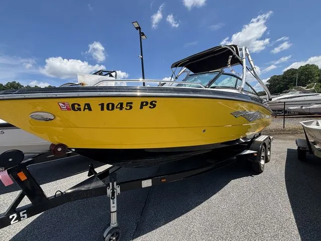 Slide: The Image of Yellow 2012 Monterey 224 FS boat on trailer. - 8
