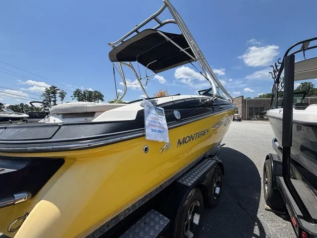 Slide: The Image of Yellow 2012 Monterey 224 FS boat on trailer. - 9