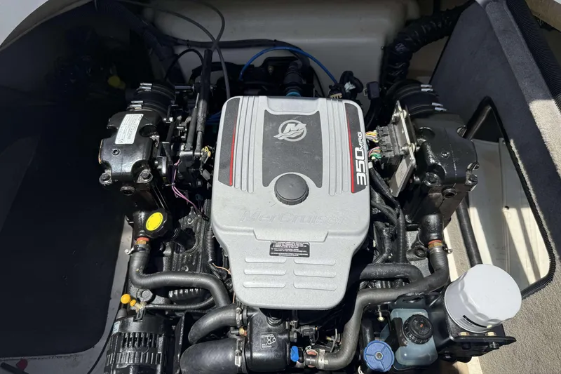 Slide: The Image of Engine compartment of a 2010 Bryant 233 boat featuring a MerCruiser 350 MAG engine. - 17