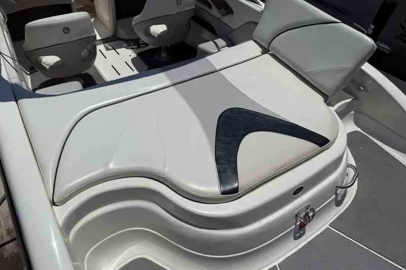 Slide: The Image of 2010 Bryant 233 boat interior with white and gray seating. - 18
