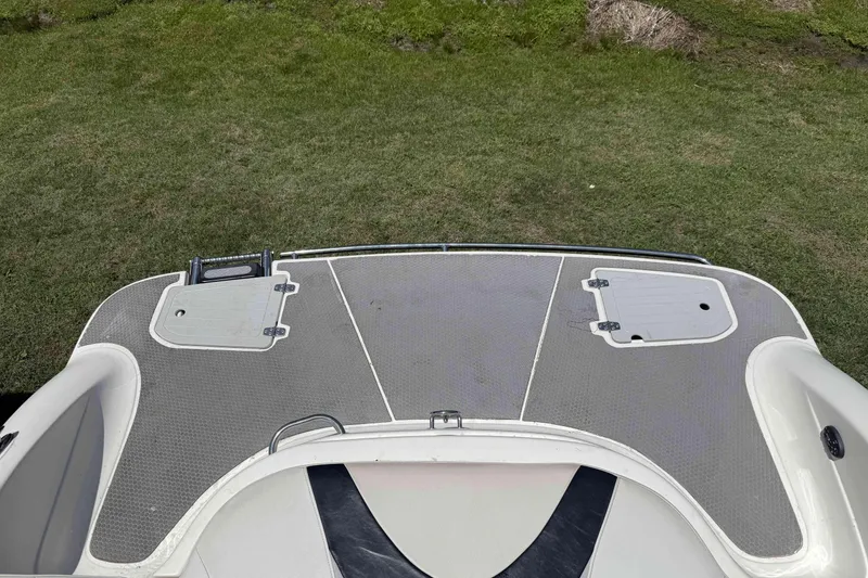 Slide: The Image of Rear deck of a 2010 Bryant 233 boat on grass. - 23