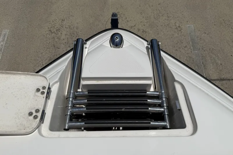 Slide: The Image of Bow of a 2010 Bryant 233 boat with a folded ladder. - 4