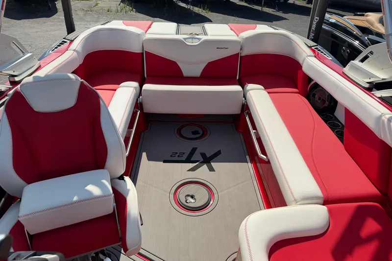 Slide: The Image of 2021 Masercraft XT22 boat interior with red and white seating, showcasing luxury design. - 11