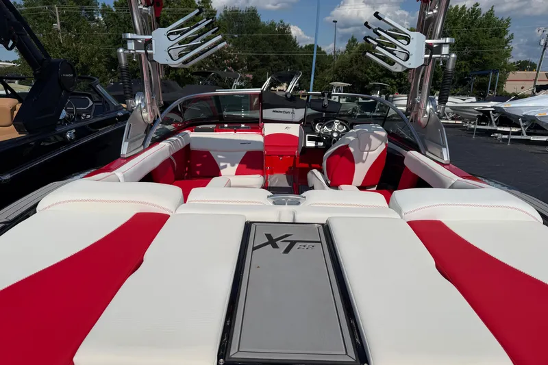 Slide: The Image of 2021 Masercraft XT22 boat interior with red and white seating, showcasing sleek design. - 5