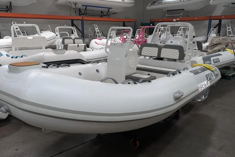 Slide: The Image of 2026 Tide Craft Catalina 13 inflatable boats in a showroom, showcasing sleek design and modern features. - 1