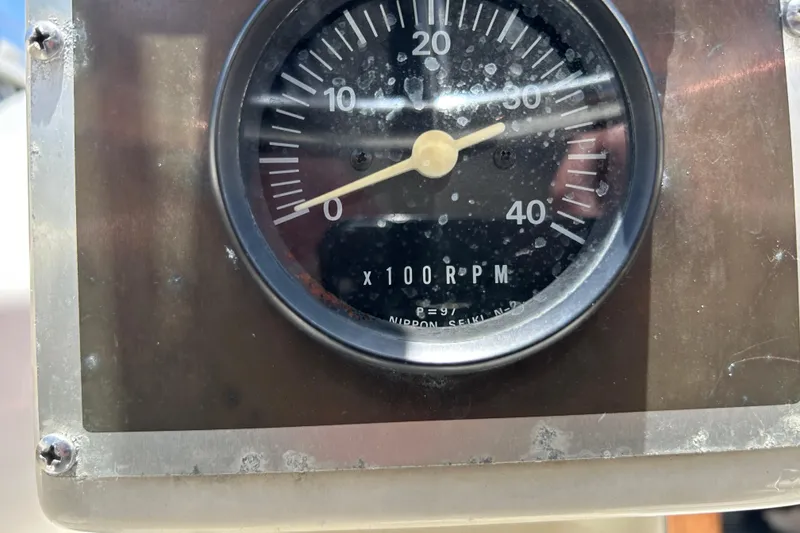 Slide: The Image of Close-up of a tachometer on a 1984 Irwin 34 sailboat, displaying RPM measurements. - 14