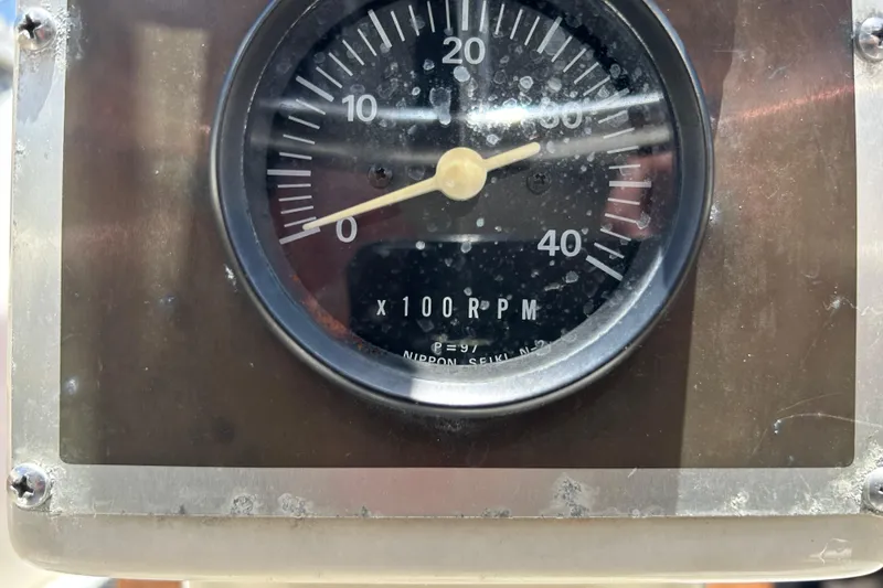 Slide: The Image of Close-up of a 1984 Irwin 34 RPM gauge, showing readings up to 40 x 100 RPM. - 15