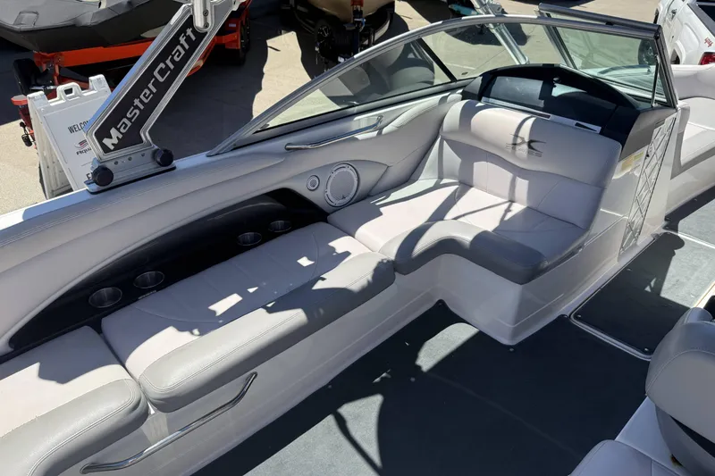 Slide: The Image of 2008 MasterCraft X-45 boat interior with white seating and cup holders. - 10
