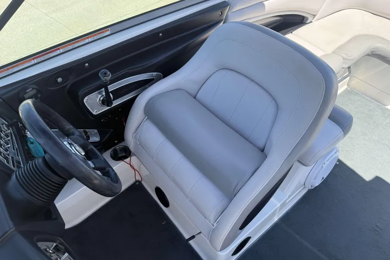 Slide: The Image of 2008 MasterCraft X-45 boat interior with steering wheel and captain's seat. - 13