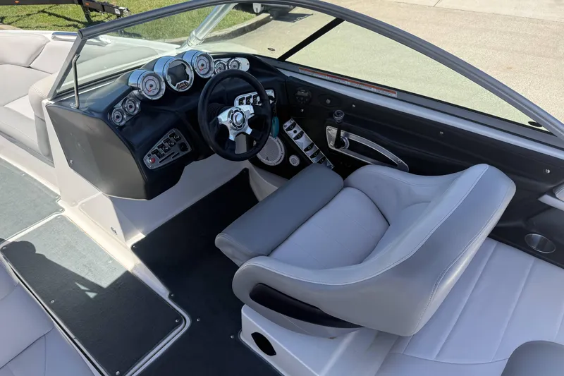 Slide: The Image of 2008 MasterCraft X-45 boat interior with sleek dashboard and comfortable seating. - 14