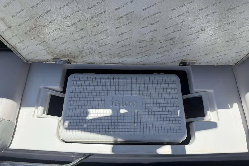Slide: The Image of MasterCraft X-45 2008 boat with Igloo cooler in storage compartment. - 20