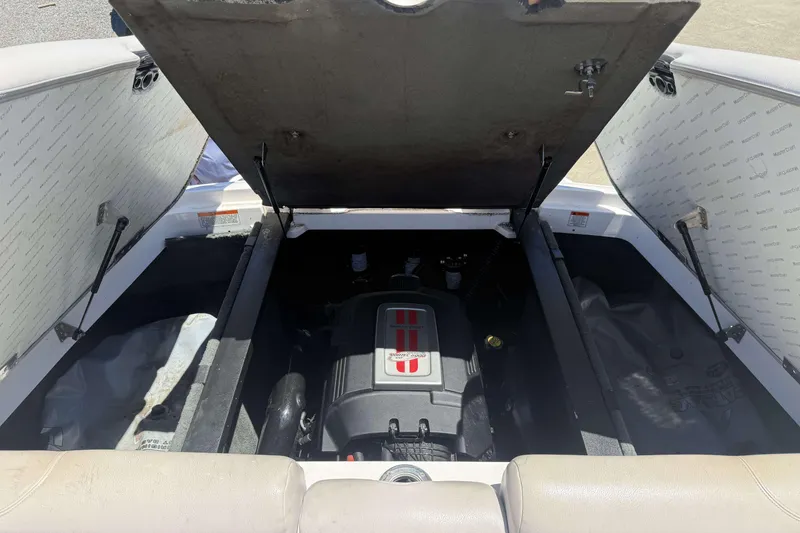 Slide: The Image of Open engine compartment of 2008 MasterCraft X-45 boat, showcasing engine details. - 22