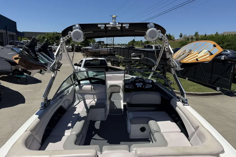 Slide: The Image of 2008 MasterCraft X-45 boat interior with wakeboard racks and speakers, parked outdoors. - 26