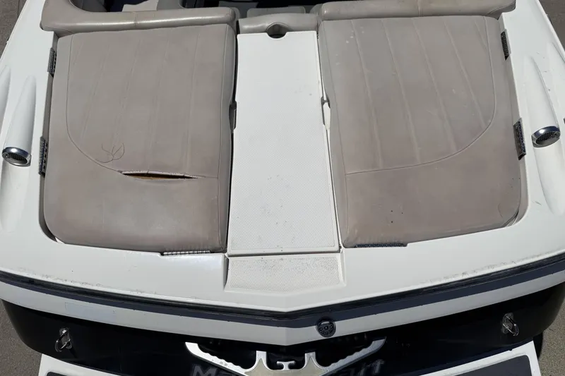 Slide: The Image of 2008 MasterCraft X-45 boat with worn beige upholstery and visible tear. - 27