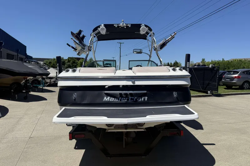 Slide: The Image of 2008 MasterCraft X-45 boat rear view, parked outdoors on a sunny day. - 3
