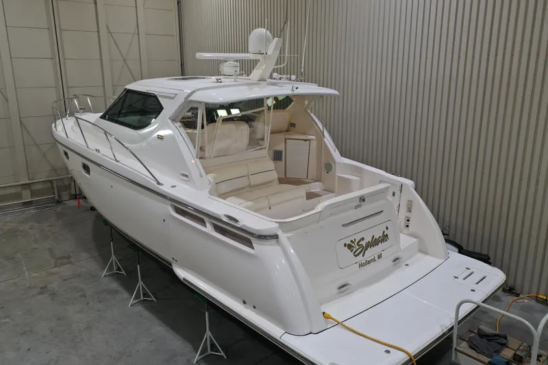 Slide: The Image of 2007 Tiara Yachts 4300 Sovran in storage, showcasing sleek design and spacious deck. - 2