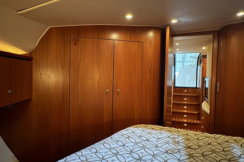 Slide: The Image of Luxurious 2007 Tiara Yachts 4300 Sovran cabin interior with wood paneling and elegant lighting. - 26